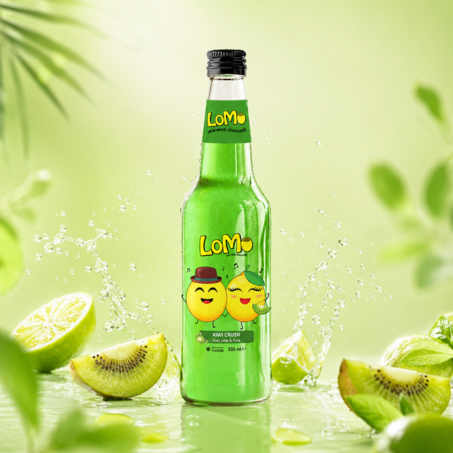 LoMo Kiwi Crush 330 ml lemonade bottle with kiwi, lime, mint, and green splash background.