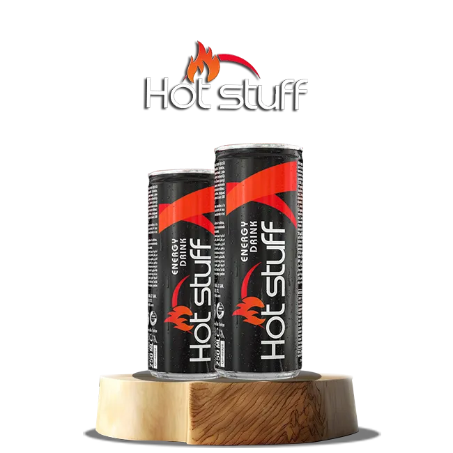 Hot Stuff energy drinks on wood - Two cans of Hot Stuff energy drinks featuring bold red and black designs with fire motifs.