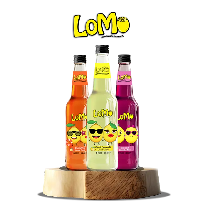 LoMo lemonade bottles on a wood stand - Brightly colored LoMo lemonade bottles featuring playful emoji faces.