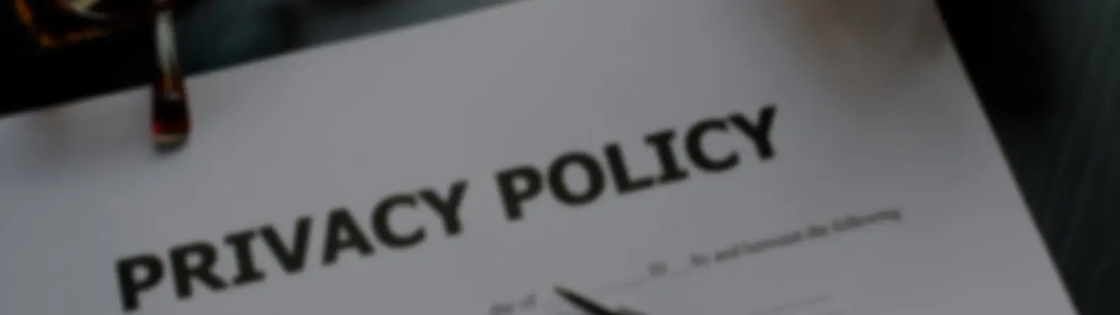 A close-up view of a document titled 'Privacy Policy,' emphasizing the significance of data protection, user privacy rights, and the measures taken to secure personal information.